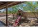 Charming backyard play structure with slide and stairs, perfect for Gathering fun and outdoor adventures at 5911 E Evergreen St, Mesa, AZ 85205