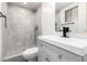 Tiled bathroom featuring updated fixtures and a glass enclosed shower at 6140 W Berkeley Rd, Phoenix, AZ 85035