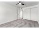 Cozy bedroom featuring a ceiling fan, closet, plush carpet, and natural light at 6140 W Berkeley Rd, Phoenix, AZ 85035