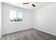 Bright bedroom featuring neutral carpet and a window view to the outside at 6140 W Berkeley Rd, Phoenix, AZ 85035