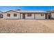 Charming single-story home with fresh white paint, gravel landscaping, and inviting covered entryway at 6140 W Berkeley Rd, Phoenix, AZ 85035