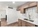 Contemporary kitchen featuring shaker cabinetry, stainless appliances, and light countertops at 6140 W Berkeley Rd, Phoenix, AZ 85035