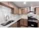 Bright, updated kitchen features stainless appliances, light countertops and modern cabinetry at 6140 W Berkeley Rd, Phoenix, AZ 85035