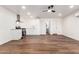 Open concept living space with wood flooring and an updated kitchen and bathroom at 6140 W Berkeley Rd, Phoenix, AZ 85035