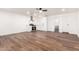 Open concept living space with wood flooring, and updated kitchen and bathroom at 6140 W Berkeley Rd, Phoenix, AZ 85035
