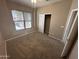 Bedroom with large window and natural light, featuring carpet flooring, and a spacious closet at 6460 S Springs Pl, Chandler, AZ 85249