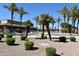 Community pool surrounded by lounge chairs and umbrellas, offering a relaxing outdoor space at 6460 S Springs Pl, Chandler, AZ 85249