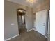 Inviting foyer with tile flooring, an arched doorway, and plenty of natural light from a window at 6460 S Springs Pl, Chandler, AZ 85249