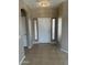 Welcoming entryway features tile floors and a front door with sidelight windows at 6460 S Springs Pl, Chandler, AZ 85249
