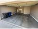 Spacious two-car garage with ample storage space and concrete flooring at 6460 S Springs Pl, Chandler, AZ 85249