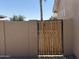 Side yard gate provides secure and private access to the home's outdoor spaces at 6460 S Springs Pl, Chandler, AZ 85249