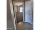 Hallway perspective showcasing the bedroom through an open doorway with tile flooring at 6460 S Springs Pl, Chandler, AZ 85249