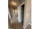 Hallway featuring tile flooring, a closet, and multiple doorways at 6460 S Springs Pl, Chandler, AZ 85249