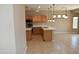 Bright kitchen featuring wood cabinets, stainless steel appliances, and a large kitchen island at 6460 S Springs Pl, Chandler, AZ 85249