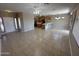 Open-concept living space showcasing tile flooring that connects the kitchen and living area at 6460 S Springs Pl, Chandler, AZ 85249