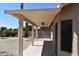 Extended covered patio featuring a ceiling fan, ideal for outdoor entertaining and relaxation at 6460 S Springs Pl, Chandler, AZ 85249