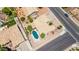 Aerial view of a home highlighting a private pool, tile roof, yard, mature trees and location at 6645 E Preston St, Mesa, AZ 85215
