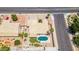 Overhead view of a residential property with a pool, patio, mature trees, and manicured lawn at 6645 E Preston St, Mesa, AZ 85215