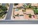 A lovely home with a refreshing blue pool sits atop a manicured desert landscape at 6645 E Preston St, Mesa, AZ 85215