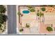 Aerial view of a property showcasing the pool, tile roof, desert landscaping, and street access at 6645 E Preston St, Mesa, AZ 85215