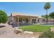 Charming backyard with a covered patio, a well-maintained lawn, and a fenced in private pool at 6645 E Preston St, Mesa, AZ 85215