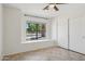 Bedroom with closet, window, and ceiling fan at 6645 E Preston St, Mesa, AZ 85215