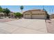 Attractive single-story home with a three car garage, basketball hoop and mature landscaping at 6645 E Preston St, Mesa, AZ 85215