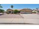 Charming home featuring low maintenance landscaping, tile roof, and a spacious three car garage at 6645 E Preston St, Mesa, AZ 85215