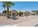 Beautiful single-story home featuring a tile roof, mature landscaping, and a three-car garage at 6645 E Preston St, Mesa, AZ 85215