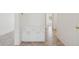 Hallway featuring a built-in cabinet with decorative tile flooring and neutral paint at 6645 E Preston St, Mesa, AZ 85215