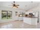 Eat-in kitchen featuring white cabinetry, tile backsplash, and stainless steel appliances at 6645 E Preston St, Mesa, AZ 85215