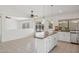Open kitchen with center island looks into an adjoining living space at 6645 E Preston St, Mesa, AZ 85215