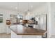 Close up of kitchen island with tile countertop, stainless steel appliances and cabinetry at 6645 E Preston St, Mesa, AZ 85215