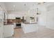 Open kitchen features stainless steel appliances, a center island, and pendant lighting at 6645 E Preston St, Mesa, AZ 85215