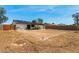 A backyard with patio, solar panels and block wall surrounding the property at 733 E Halifax St, Mesa, AZ 85203