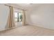 Carpeted bedroom with neutral walls, a large window, and plenty of light at 733 E Halifax St, Mesa, AZ 85203