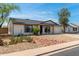 Charming single-level home featuring desert landscaping and a two-car garage at 733 E Halifax St, Mesa, AZ 85203