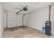 An empty two car garage with a cement floor and garage door opener at 733 E Halifax St, Mesa, AZ 85203