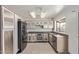Well lit kitchen with stainless steel appliances and tile flooring at 733 E Halifax St, Mesa, AZ 85203