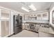 Well lit kitchen with stainless steel appliances and tile flooring at 733 E Halifax St, Mesa, AZ 85203