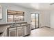 Functional kitchen space offering ample counter space and convenient access to the outdoors at 733 E Halifax St, Mesa, AZ 85203