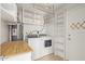 Bright laundry room with washer, dryer, water heater, shelving and storage at 733 E Halifax St, Mesa, AZ 85203