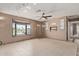 Inviting living room showcasing a large bay window, tile floors, and stylish track lighting at 733 E Halifax St, Mesa, AZ 85203
