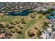 Stunning aerial view of the golf course community with lush landscaping, water features and meticulously maintained greenery at 7531 W Kimberly Way, Glendale, AZ 85308