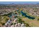 Wide aerial shot capturing the community's amenities, including the golf course, tennis courts, and neighborhood homes at 7531 W Kimberly Way, Glendale, AZ 85308