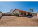 Spacious backyard with covered patio, perfect for outdoor entertaining and relaxation with a privacy wall at 7531 W Kimberly Way, Glendale, AZ 85308
