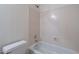 This bathroom features a shower and bath combination with cream colored walls at 7531 W Kimberly Way, Glendale, AZ 85308