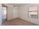 This bedroom features a closet with sliding doors and a large window at 7531 W Kimberly Way, Glendale, AZ 85308