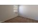 This bedroom features a large window letting in natural light at 7531 W Kimberly Way, Glendale, AZ 85308