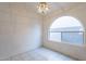 The dining room is well-lit with a large arched window and neutral tile flooring at 7531 W Kimberly Way, Glendale, AZ 85308